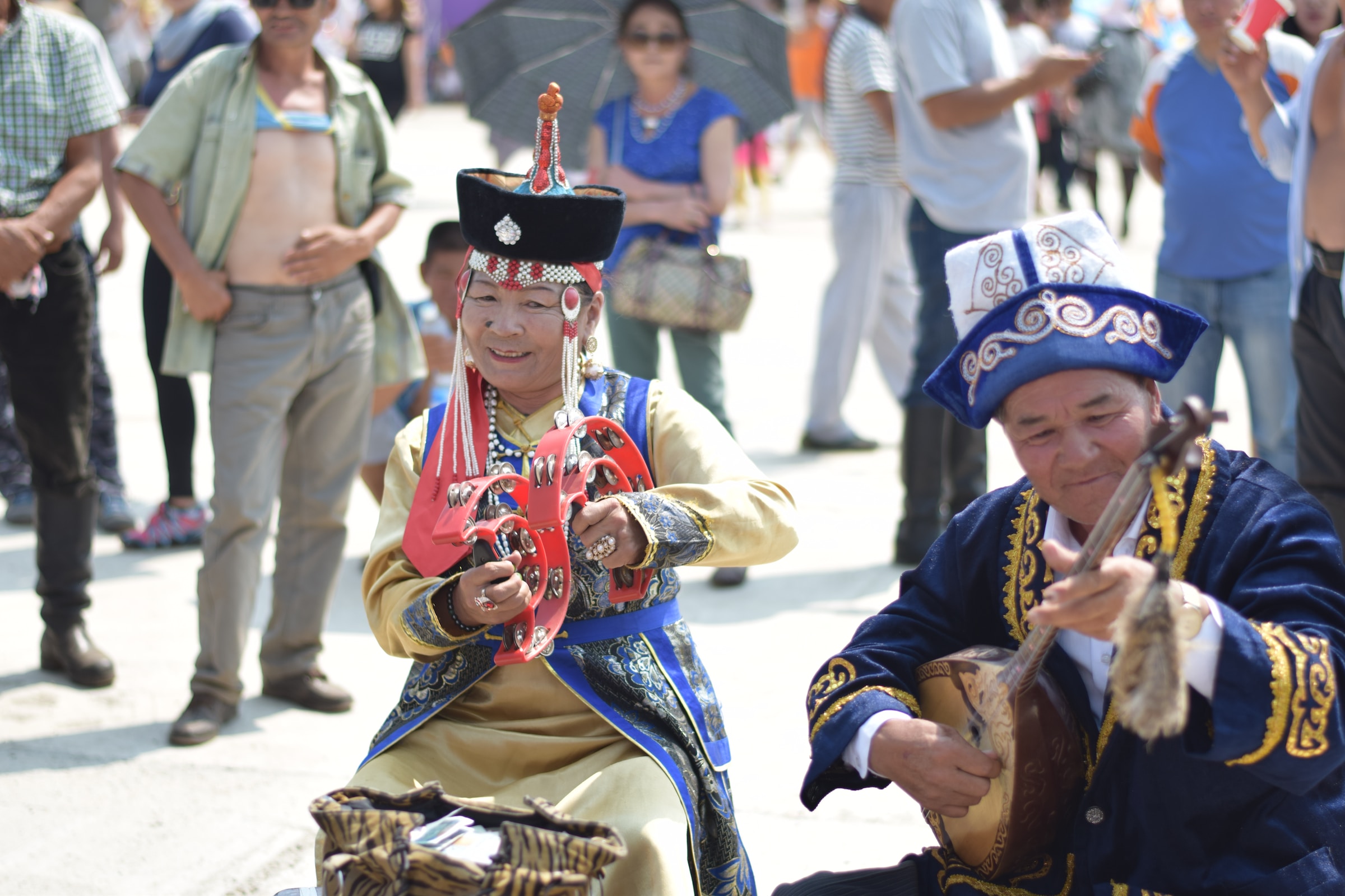 locals playing musical instruments at the Naadam Festival in Mongolia